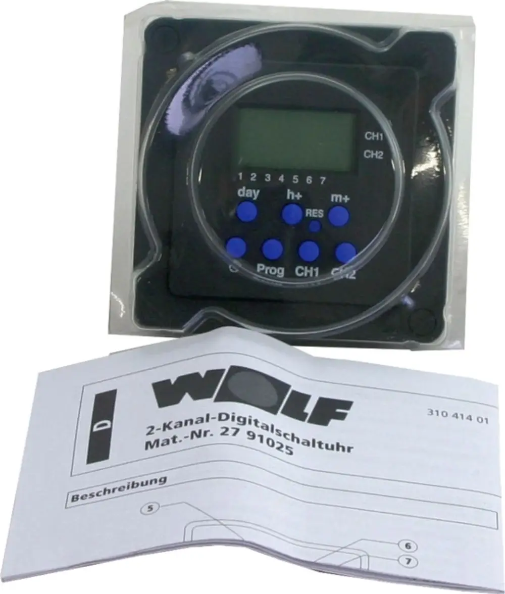 Digitalschaltuhr von Wolf mit LCD-Display und Tasten zur Programmierung, um die Zeitsteuerung in zwei Kanälen zu ermöglichen. Gebrauchsanweisung liegt daneben.